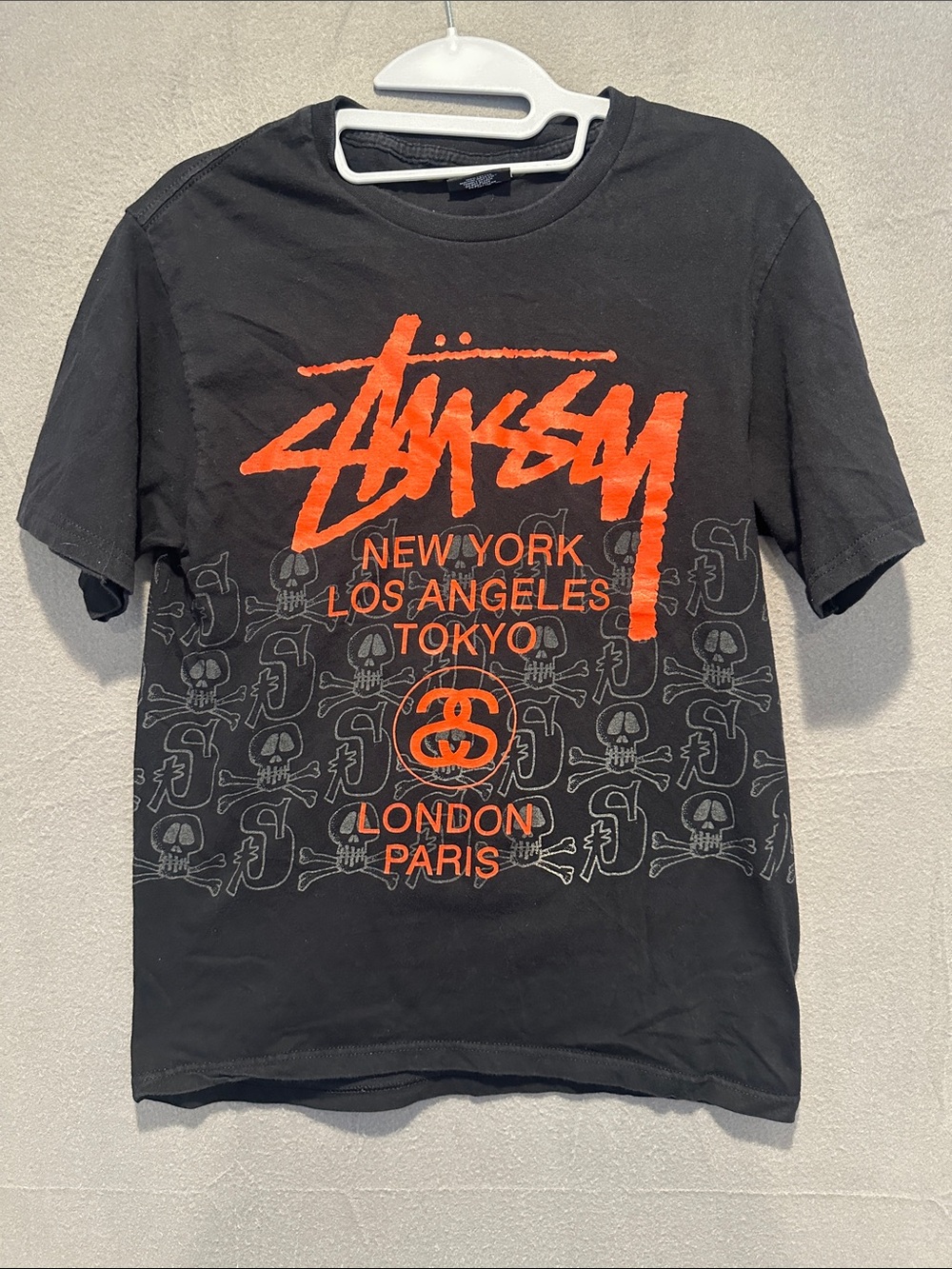 Stussy Black Tee with Bright Orange Logo and City Print